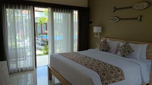 Kubu Garden Suites & Villas Nusa Dua客房内的一张或多张床位