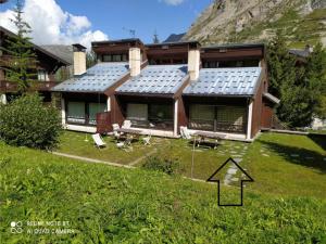 a house with solar panels on the front of it at Chalet Val-d'Isère, 3 pièces, 4 personnes - FR-1-518-101 in Val-d'Isère