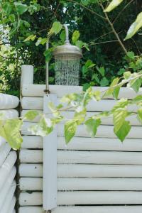 a bird feeder on a white fence at Senhora do Cabo Meco Homy Holidays in Sesimbra