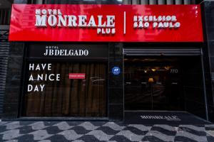 a store front with a red sign on the window at DELPLAZA Excelsior São Paulo - By Monreale in Sao Paulo