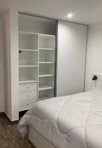 Ένα ή περισσότερα κρεβάτια σε δωμάτιο στο Pura Vida 1