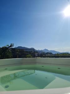 a swimming pool with a view of the mountains at Sant' Martre in Rio de Janeiro