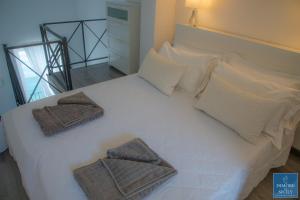 Posteľ alebo postele v izbe v ubytovaní Alfeo Bellevue by Dimore in Sicily