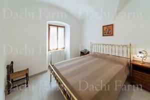Posteľ alebo postele v izbe v ubytovaní Appartamento Alba Dachi Farm