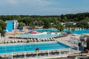 a large swimming pool in a resort at Camping SIBLU - La réserve in Gastes