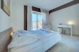 a bedroom with a large bed and a window at 2 room center very comfortable wi fi in Cannes