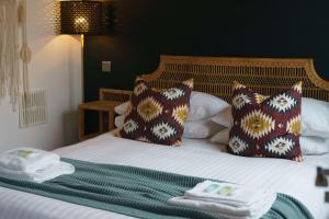 a hotel room with a bed with towels on it at BLACKBURNE ARMS ,24 CATHARINE STREET HOTEL in Liverpool