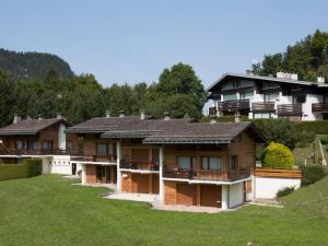 a row of houses on a hill with grass at Appartement La Clusaz, 3 pièces, 6 personnes - FR-1-437-59 in La Clusaz