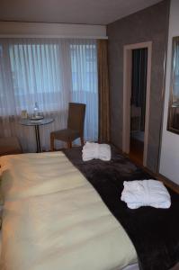 Postel nebo postele na pokoji v ubytování Hotel Belmont
