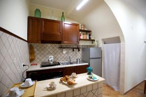 Кухня или мини-кухня в Dimora Sogno Suite
