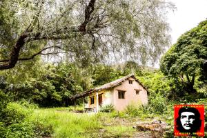 a small house in the middle of a field at Casa del Telegrafista in La Higuera