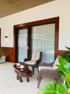 A seating area at ORA Beach Resort
