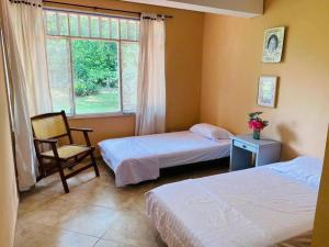 Voodi või voodid majutusasutuse Agradable finca campestre familiar con piscina toas