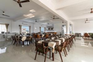 a large dining room with tables and chairs at Revaas Lake View Boutique Hotel in Udaipur