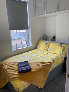 Postel nebo postele na pokoji v ubytování Harvey Apartments