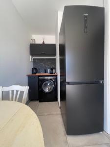 Kuchyň nebo kuchyňský kout v ubytování Appartement dans maison de village vue mer