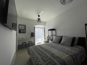 Postel nebo postele na pokoji v ubytování Appartement dans maison de village vue mer