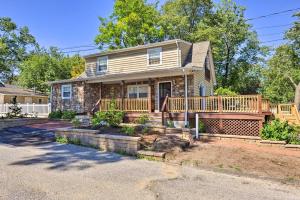 a house with a deck and a porch at Sunny Glen Burnie Home - On-Site Water Access in Glen Burnie