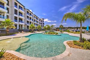 a swimming pool in front of a building at Lakeside Montgomery Condo Near Boat Rental! in Montgomery