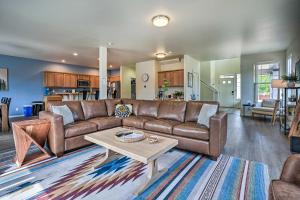 a living room with a couch and a coffee table at Serene Bend Getaway with Hot Tub and Fire Pit! in Bend