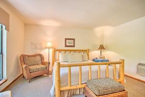 a bedroom with a bed and a chair at Bright Davis Escape with Screened-In Porch! in Davis