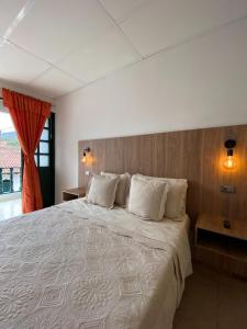 Postel nebo postele na pokoji v ubytování Hotel Paso Realce