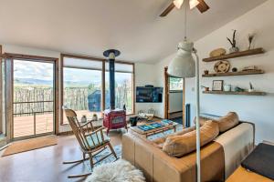 a living room with a couch and a table at El Prado Duplex with Deck and Grill - 4 Mi to Town! in El Prado