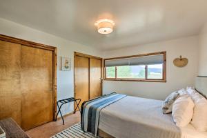 a bedroom with a bed and a window at El Prado Duplex with Deck and Grill - 4 Mi to Town! in El Prado