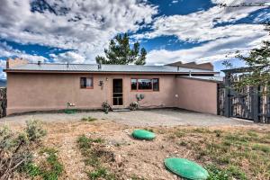 a house with two green frisbees in the yard at El Prado Duplex with Deck and Grill - 4 Mi to Town! in El Prado