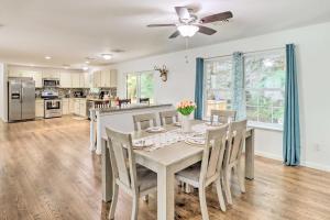 a kitchen and dining room with a table and chairs at Gorgeous Pocono Summit Retreat with Game Room! in Pocono Summit