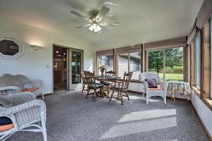 a living room with a table and chairs at Welcoming Sturgis Getaway with Spacious Yard! in Sturgis