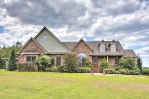 a large brick house with a large yard at Lebanon Family Getaway with Pool, Bikes and Trails! in Lebanon