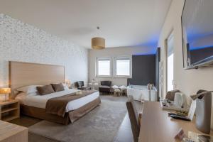 Voodi või voodid majutusasutuse Hotel Torre Del Sud toas +37 fotot