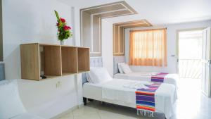 Postel nebo postele na pokoji v ubytování Hotel Playa Divina