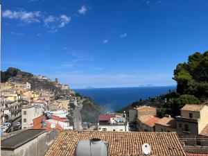 a view of a city with the ocean in the background at Calacta casa mia in Caronia