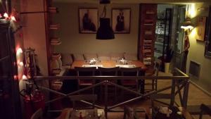 a dining room with a table and chairs in it at Xanthippi Hotel in Souvala