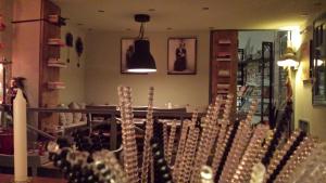 a bunch of wine glasses in a wine shop at Xanthippi Hotel in Souvala