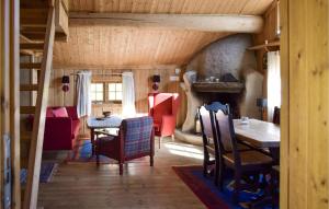 a room with a table and chairs in a house at Stallen 2 in Rauland