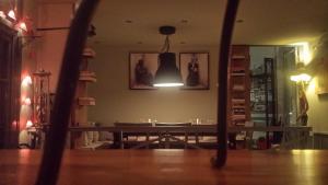 a room with a table and a light in it at Xanthippi Hotel in Souvala