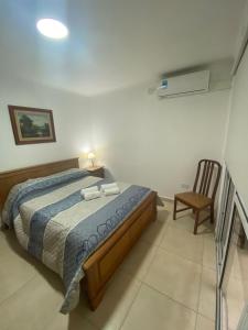 Ein Bett oder Betten in einem Zimmer der Unterkunft Departamento Gastón