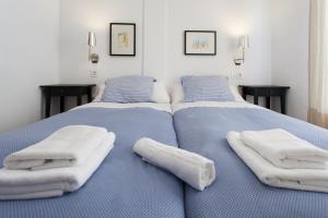 En eller flere senge i et værelse på Apartamentos Diaber Laraña