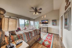 a bedroom with a bed and a ceiling fan at Living the Dream, 3 Bedrooms, Hot Tub, Fireplace, Sleeps 6 in Ruidoso