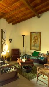 a living room with a couch and a table at La Casa Amarilla in Jardin