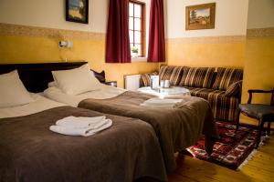 Letto o letti in una camera di Värdshuset Hwitan