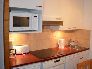 Kjøkken eller kjøkkenkrok på Appartement Saint-Martin-de-Belleville-Les Menuires, 2 pièces, 4 personnes - FR-1-452-114