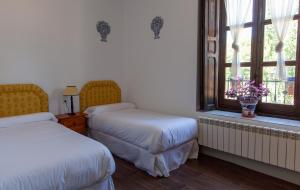 Postel nebo postele na pokoji v ubytování La Villa del Pantano