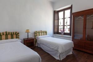 Postel nebo postele na pokoji v ubytování La Villa del Pantano