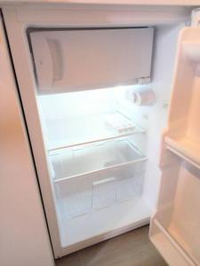 an open refrigerator with its door open and its at Estudio Don Antonio en el centro de La Laguna in La Laguna