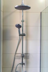 a shower in a bathroom with a shower head at Casa Los Mangos - Increíbles vistas in Playa de Santiago