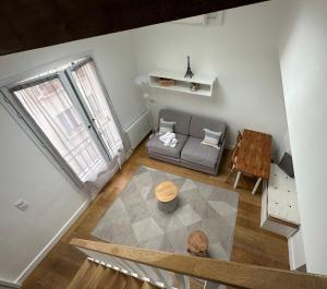 an overhead view of a living room with a couch and a table at Beatrice et Emmanuel Meublé Eiffel in Paris